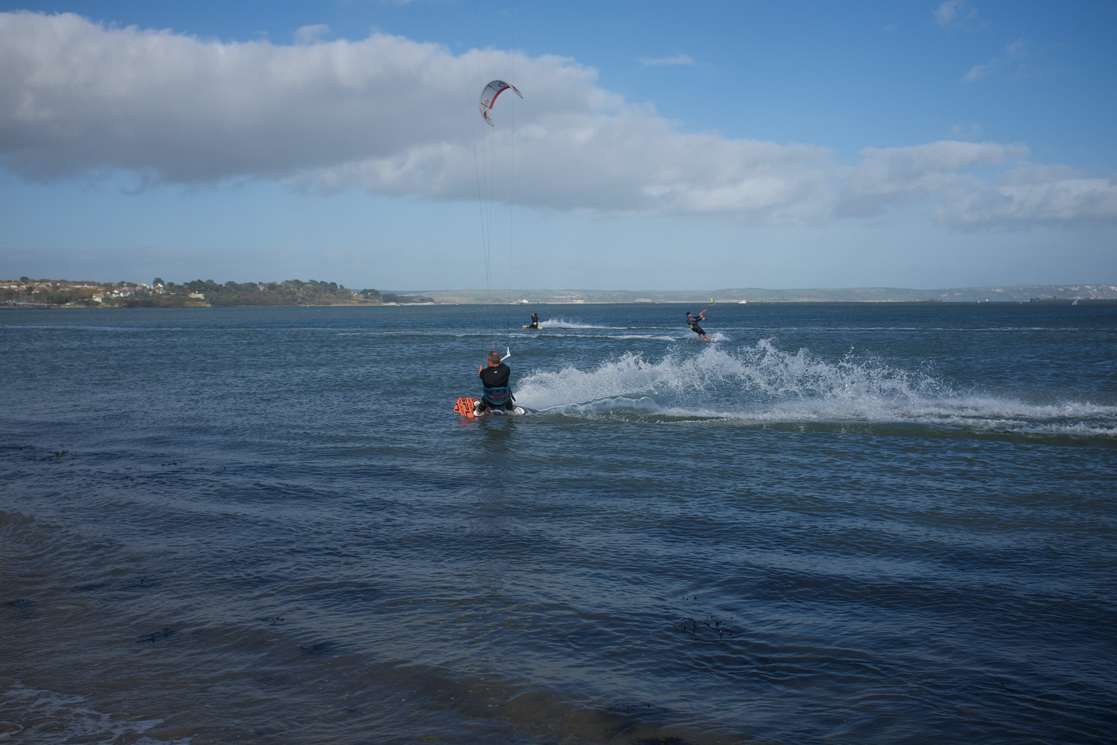 A kite surfer enjoying a perfect day. | © Unsplash / Dave Robinson