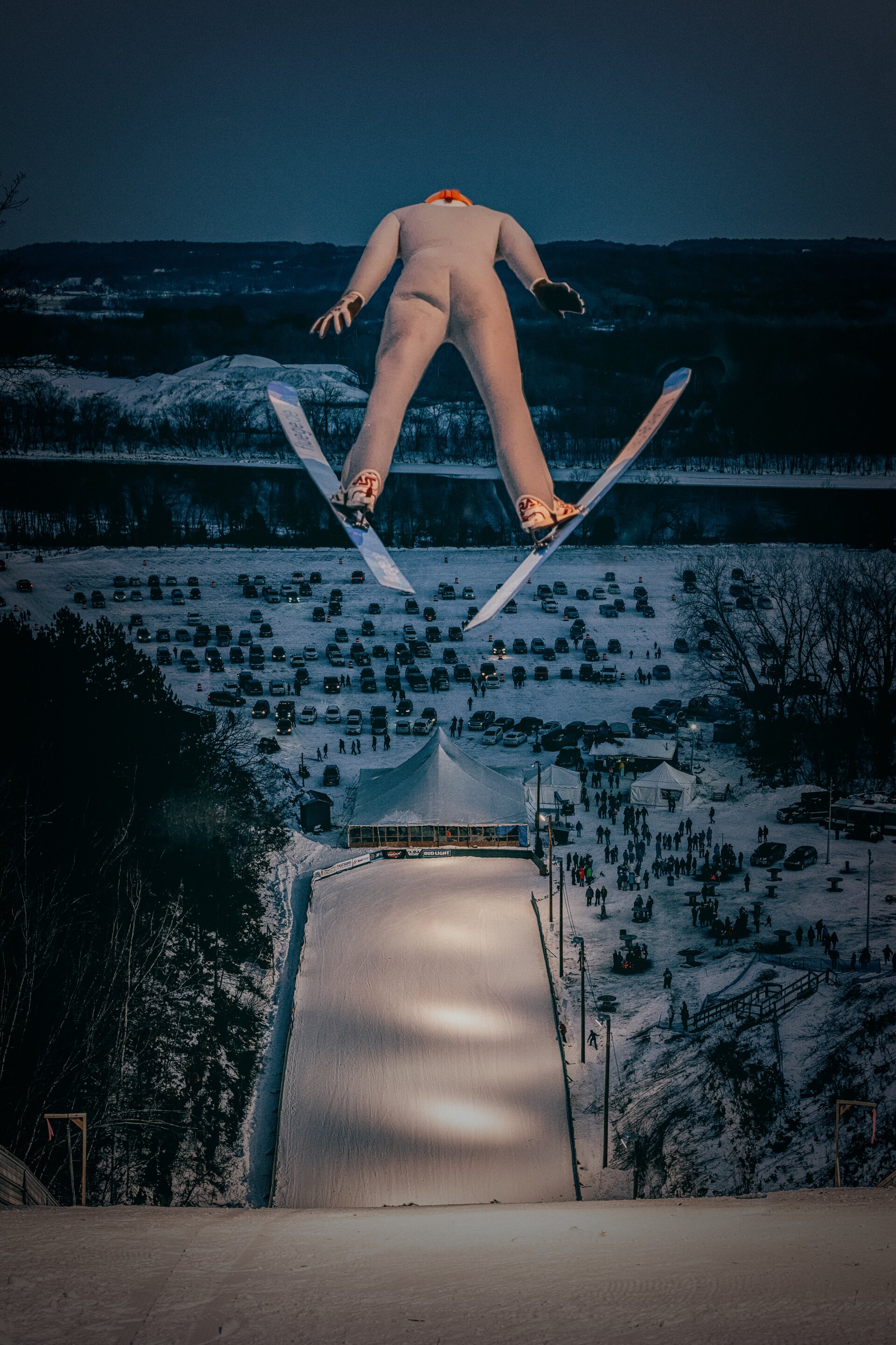 This shot required belly climbing underneath the jump to try and get the right angle. Had to time it by sound alone (they sound like a freight train right overhead). A whole lot of work...but boy what a payoff.  The ski jumpers perspective.