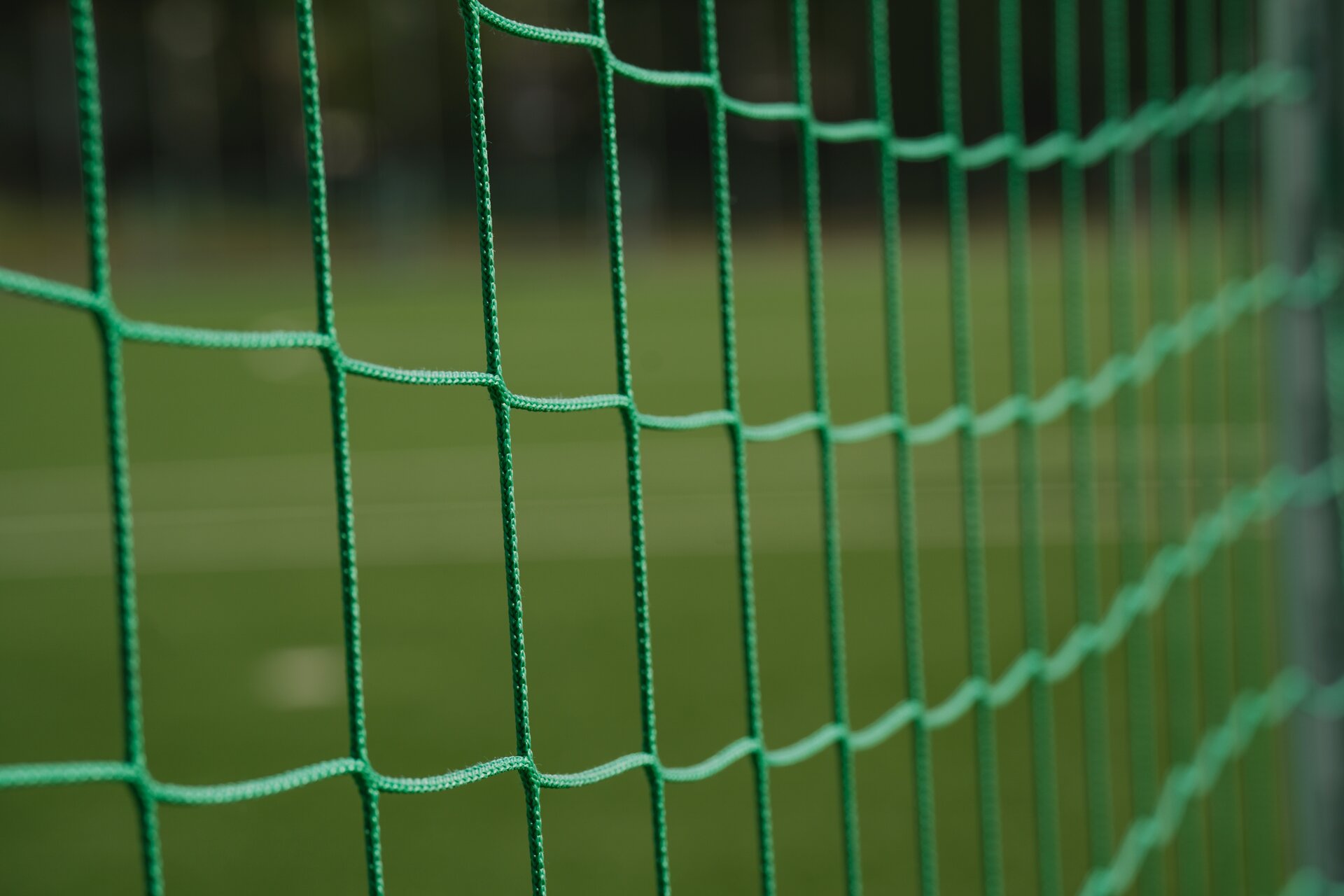A net of a soccer goal with a blurry background. ⚽️