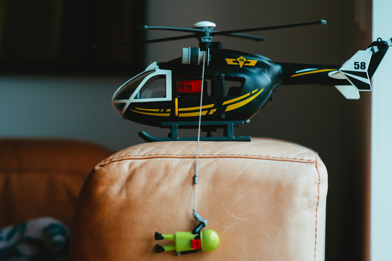 Playmobil mountain rescue service heli with crew. Made with Canon 5d Mark III and analog vintage lens, Leica  Elmarit-R 2.8 135mm (Year: 1987) | © Unsplash / Markus Spiske