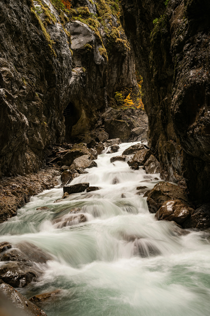 Long time exposure of a river in a ravine, surrounded by rocks | © Unsplash / Babette Landmesser