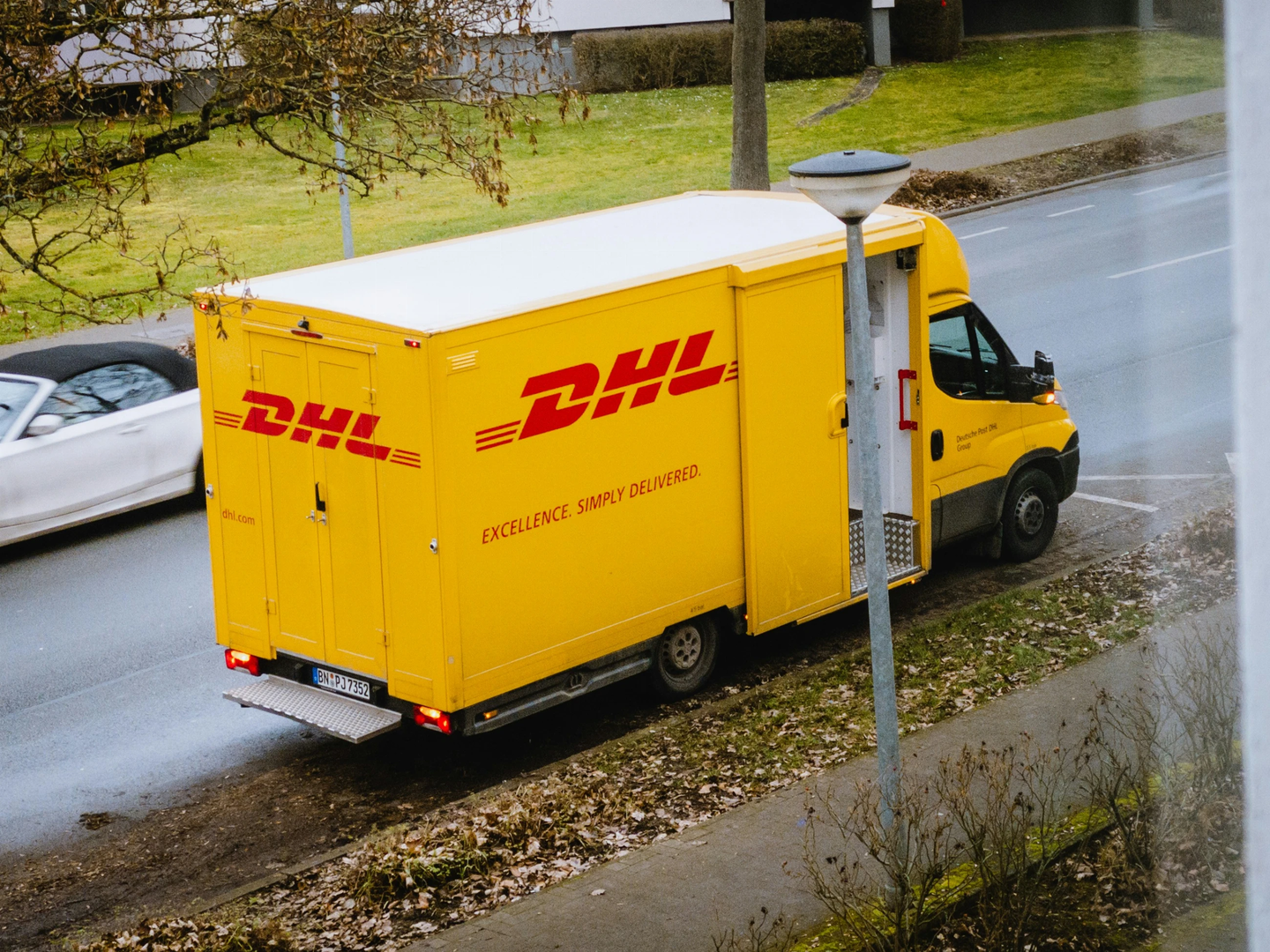 DHL Germany - Delivery Vehicle
 | © Unsplash / Maxim