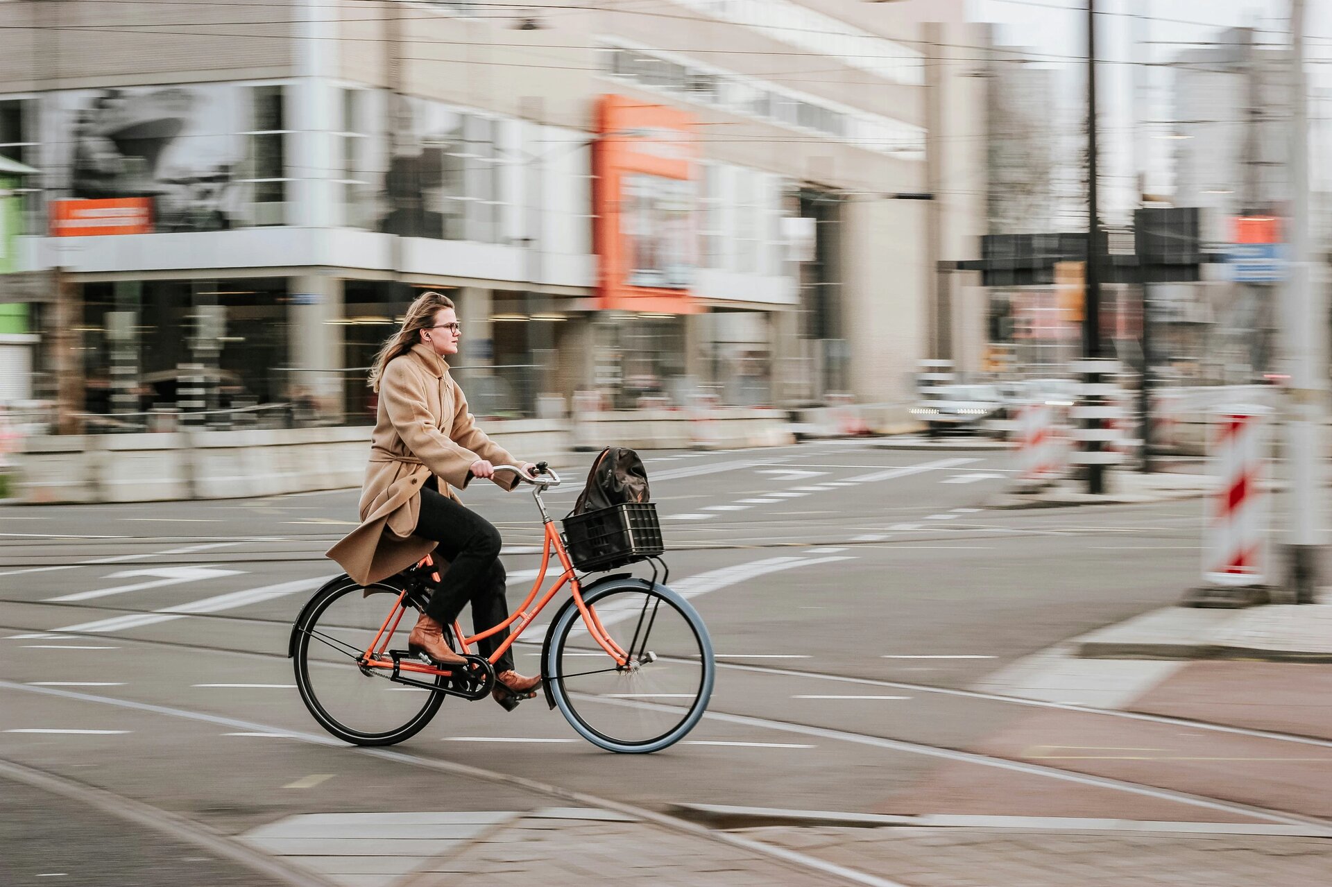 Young woman riding bike in Rotterdam