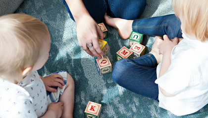 This image was taken for my client, Nannybird—an LA-based nanny service. I shot at a chic hotel in Hollywood and lucked out with the all-white walls that served as a fabulous bounce card for the floor to ceiling windows that had gorgeous afternoon light streaming in. This image was a detail shot for the day, showcasing one of the nannies playing blocks with the children, who were both eagerly engaged—a rare moment for the rambunctious ones!  ; ) | © Unsplash / Marisa Howenstine